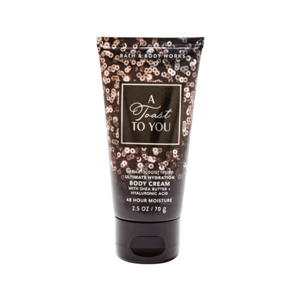 Tube of Bath & Body Works body cream with floral design on a white background